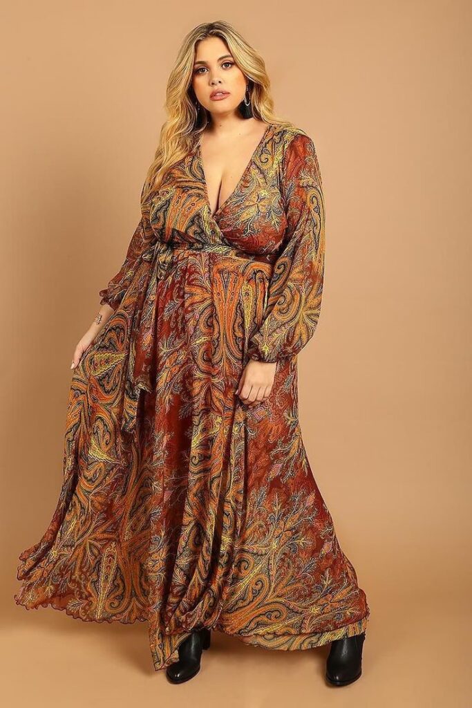 Plus size woman wearing a flowy boho wrap dress with a relaxed summer look.