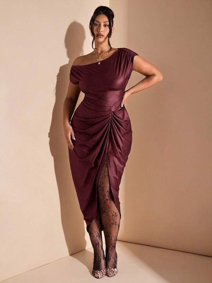 Curvy woman wearing a satin cowl neck midi dress for an evening event.