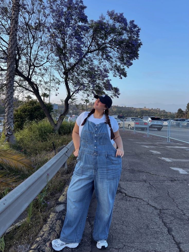 Plus size woman wearing denim overalls with a basic T-shirt for a casual weekend outfit