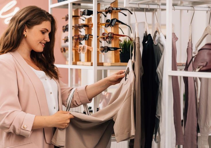 Plus size woman feeling the fabric of a garment before making a purchase