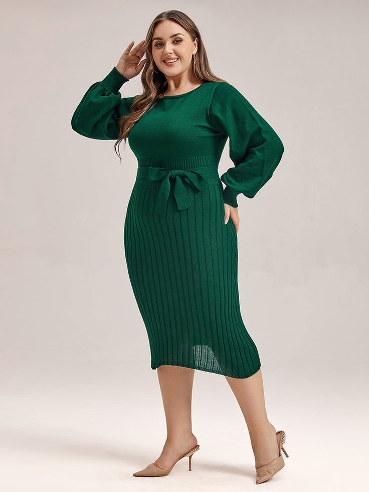 Curvy woman styling a long-sleeve midi dress with a trench coat and boots.