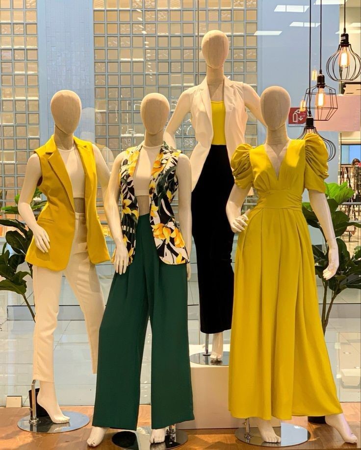 Luxury fashion boutique display featuring elegant dresses, tailored blazers, and stylish wardrobe essentials.