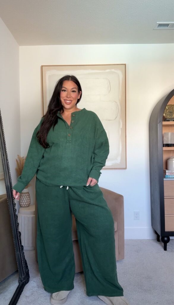 Plus-size woman wearing a green matching knit set with sneakers for a cozy rainy-day outfit.