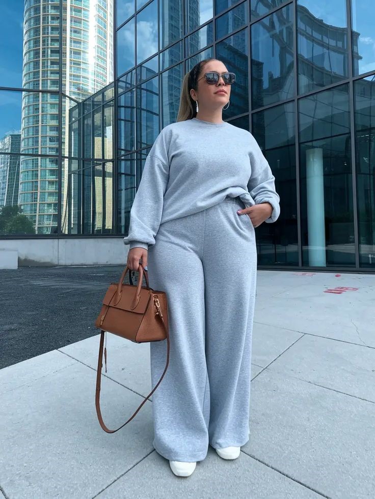 Plus-size woman wearing a matching lounge set with white sneakers for a casual everyday look