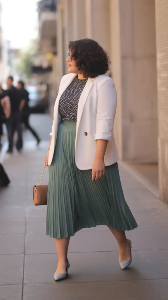 Pleated midi skirt styled for a plus size office outfit