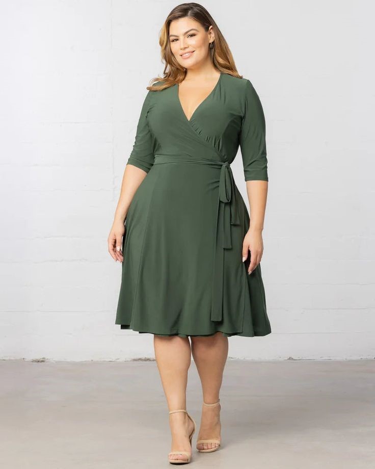 An elegant plus size woman wearing a classic wrap dress