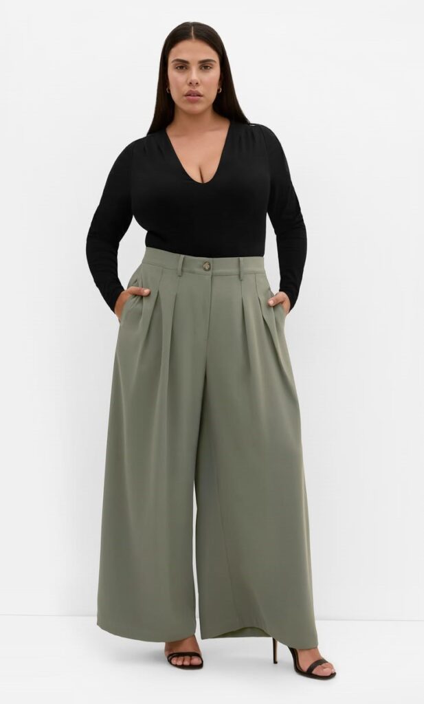 Wide-leg trousers with a statement blouse for a stylish plus size office outfit