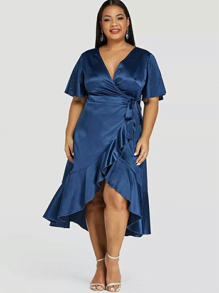 Plus size woman wearing a satin wrap dress for a wedding 
