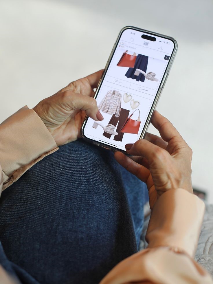 Woman shopping for plus size clothes online using a smartphone