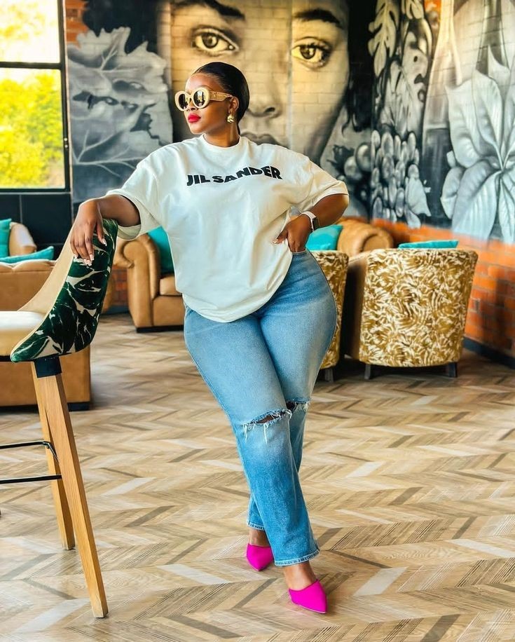 Simple casual plus-size outfit with jeans, white T-shirt, and flats