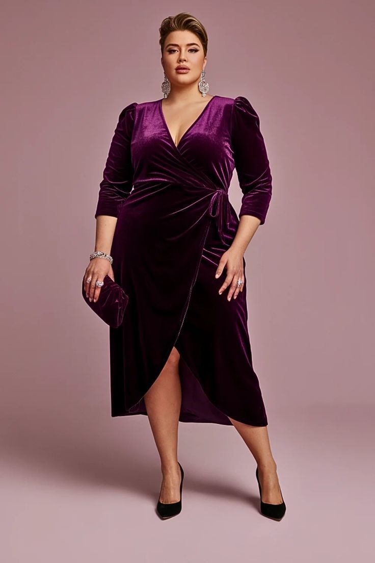 Plus size woman wearing a luxurious velvet wrap dress with a wrap waist for an elegant evening outfit.