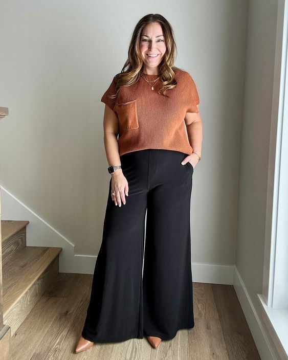 Business casual outfit featuring wide-leg trousers and a lightweight knit top for curvy women.