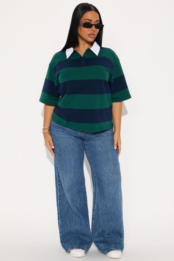 Best plus size jeans you can buy online, styled with a green and navy striped polo shirt and white sneakers