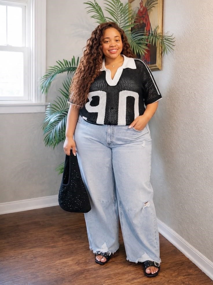 Plus Size Woman wearing light blue jeans with a black-and-white collared top and black sandals