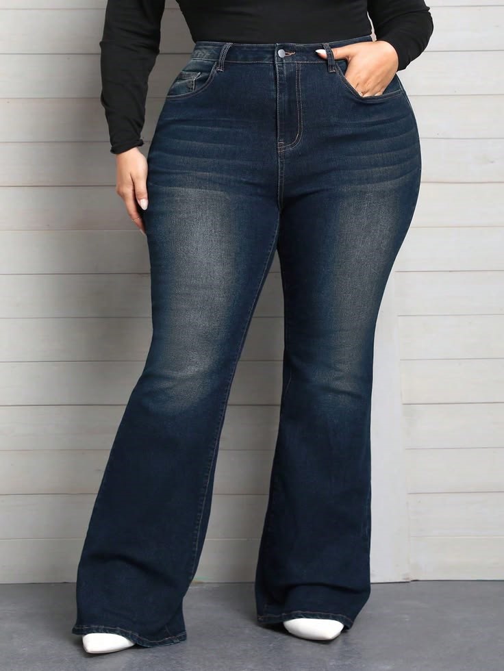 plus size woman wearing high-waisted bootcut jeans that balance her natural curves