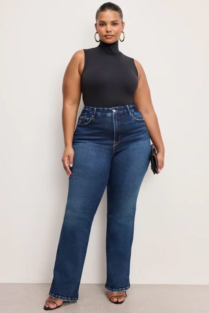 Woman wearing high-waisted straight-leg jeans with a fitted black top