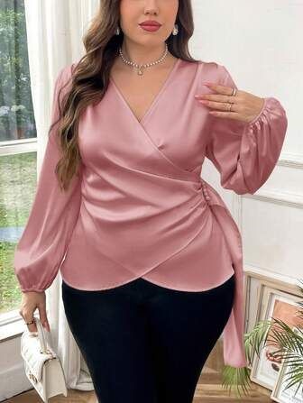 Apple-shaped plus size woman wearing a V-neck top that draws attention to the neckline