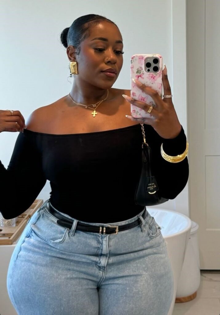 Plus size woman showing how to find jeans that fit comfortably at the waist