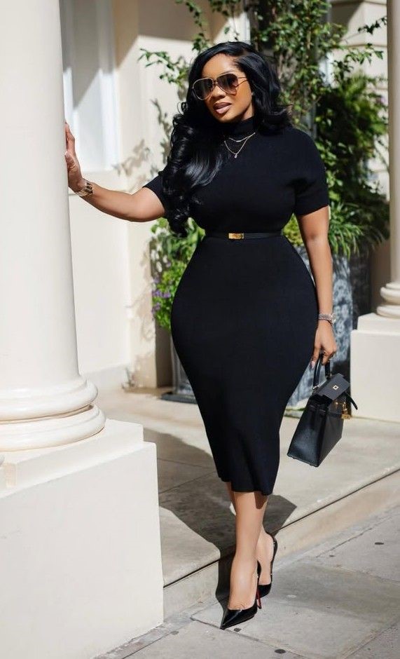 Plus size woman wearing a classic little black midi dress