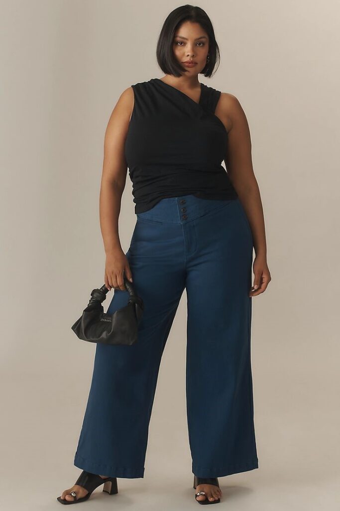 Woman wearing Universal Standard wide-leg jeans