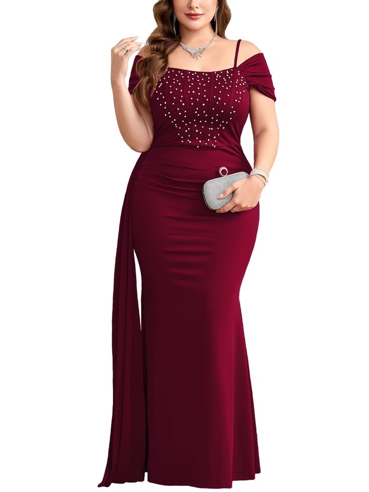 plus-size woman wearing a burgundy dress with a pearl embellished neckline.