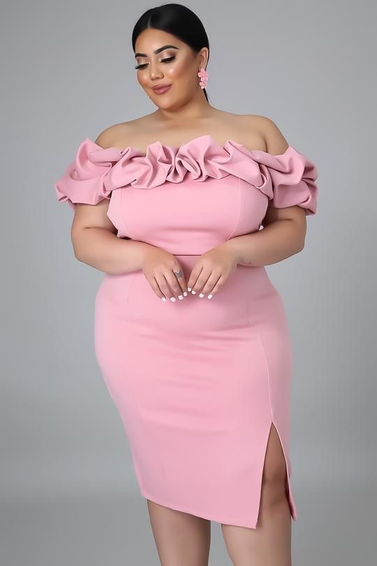 Pear-shaped plus-size woman wearing a pink off-the-shoulder dress with statement ruffle sleeves.