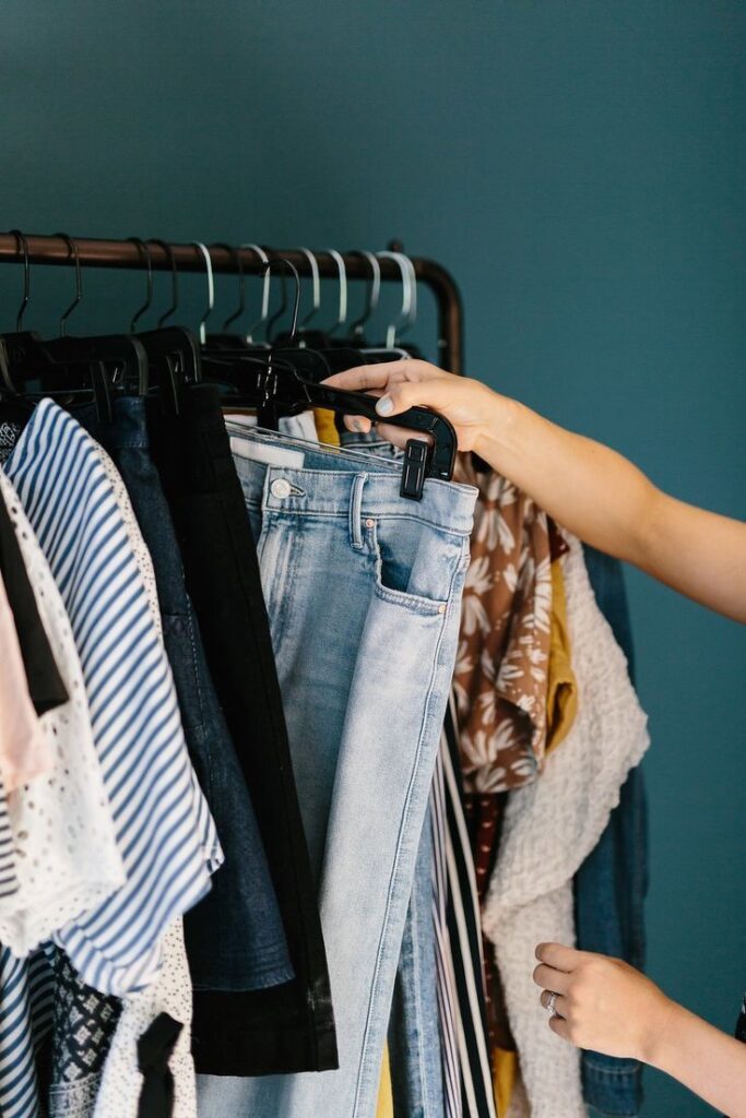 Organized clothing rack with versatile wardrobe essentials for a plus size capsule wardrobe.
