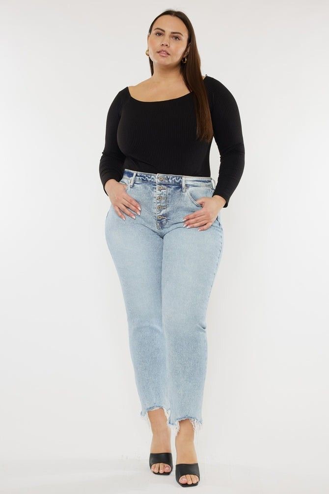 Plus size wardrobe basics with well-fitting jeans and a black top