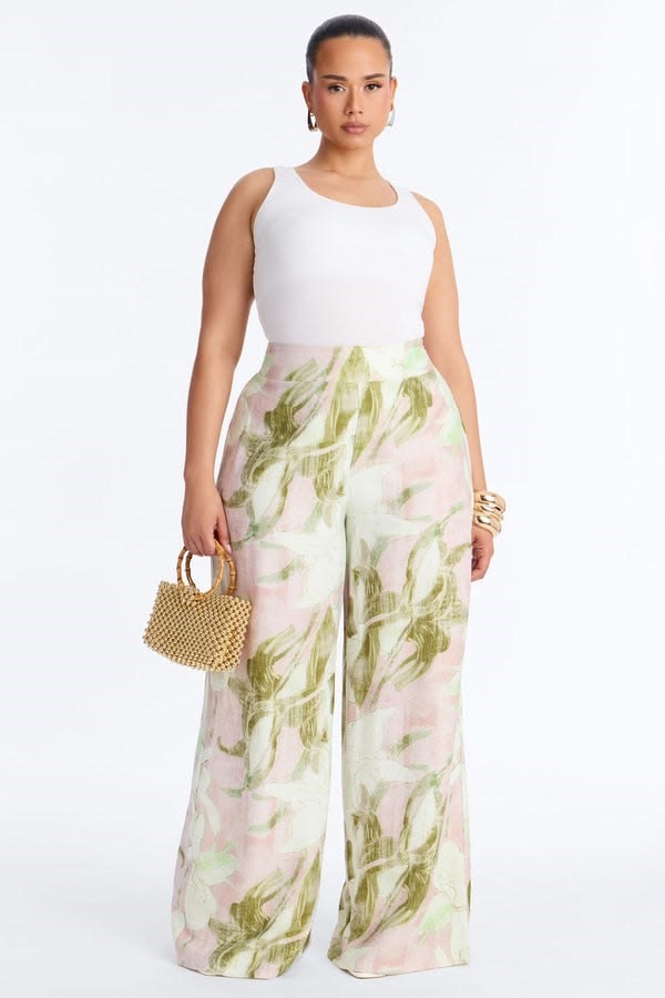 Light-coloured floral wide-leg trousers flattering for an inverted triangle body shape