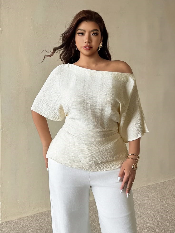 White ruched waist blouse paired with wide-leg trousers