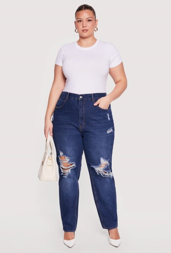 Woman wearing dark-wash straight-leg jeans with a fitted white T-shirt