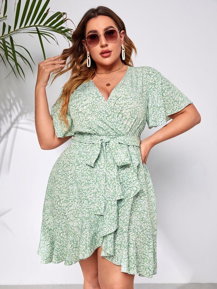 Bridal shower outfit ideas for plus size women featuring a floral wrap midi dress