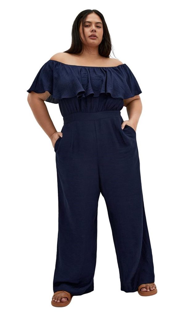 Bridal shower outfit ideas for plus size women featuring a navy off-shoulder jumpsuit