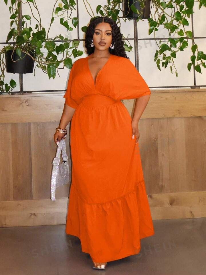 Bright orange maxi dress for a wedding guest