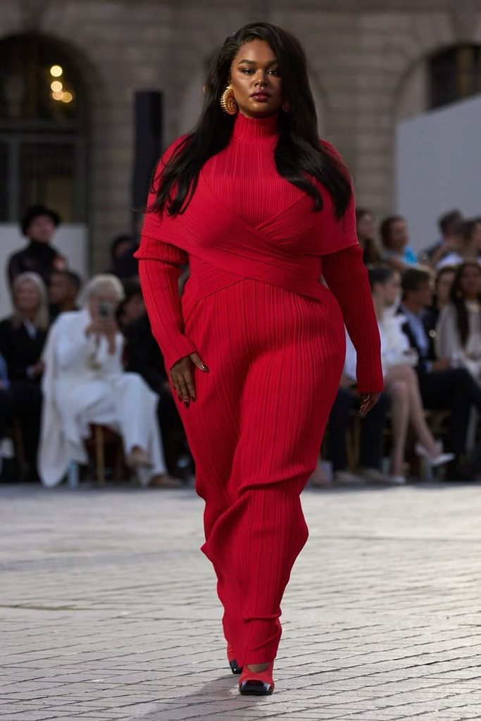 Celebrity plus size look featuring a bold red body-skimming outfit