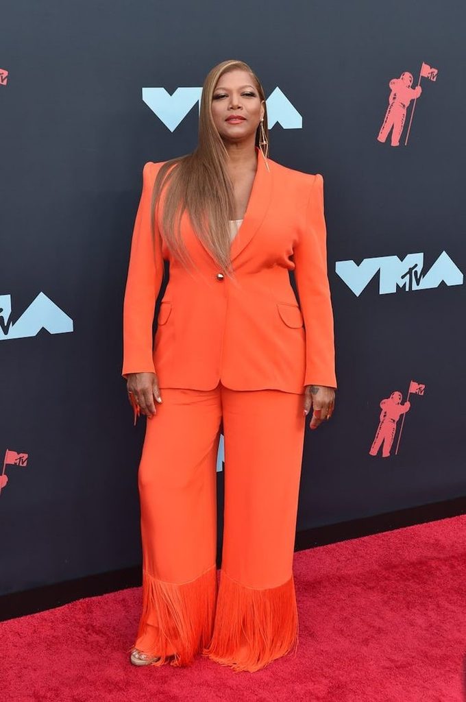 Queen Latifah wearing a bold tailored power suit