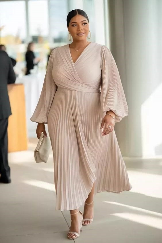 Champagne pleated midi dress for a wedding guest