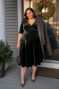 Dark green velvet midi dress for a wedding guest