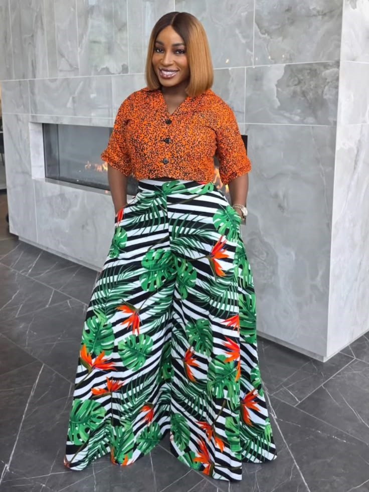 Plus size woman wearing a bold printed outfit with wide-leg trousers, challenging the fashion rule that's holding too many women back