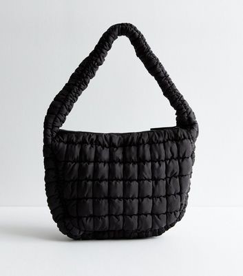 Black quilted handbag that goes with everything for casual and polished outfits