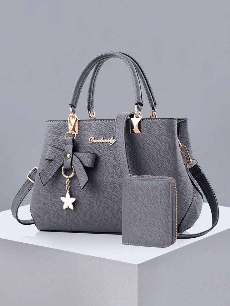 Gray medium everyday tote with top handles and shoulder strap for casual and polished outfits