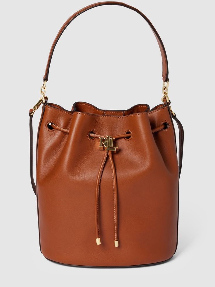 Brown bucket handbag, one of the handbags that go with everything for polished casual and everyday outfits