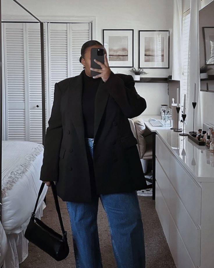 How to style an oversized blazer worn open with a black top and jeans