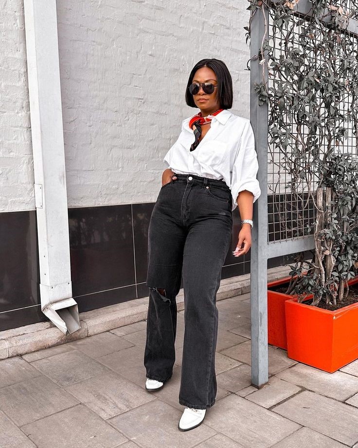 How to style black jeans with a white button-down shirt, printed scarf, and white sneakers