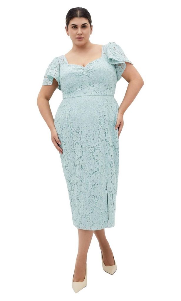 Plus size pregnant woman wearing a light blue lace-sleeve midi dress for a baby shower