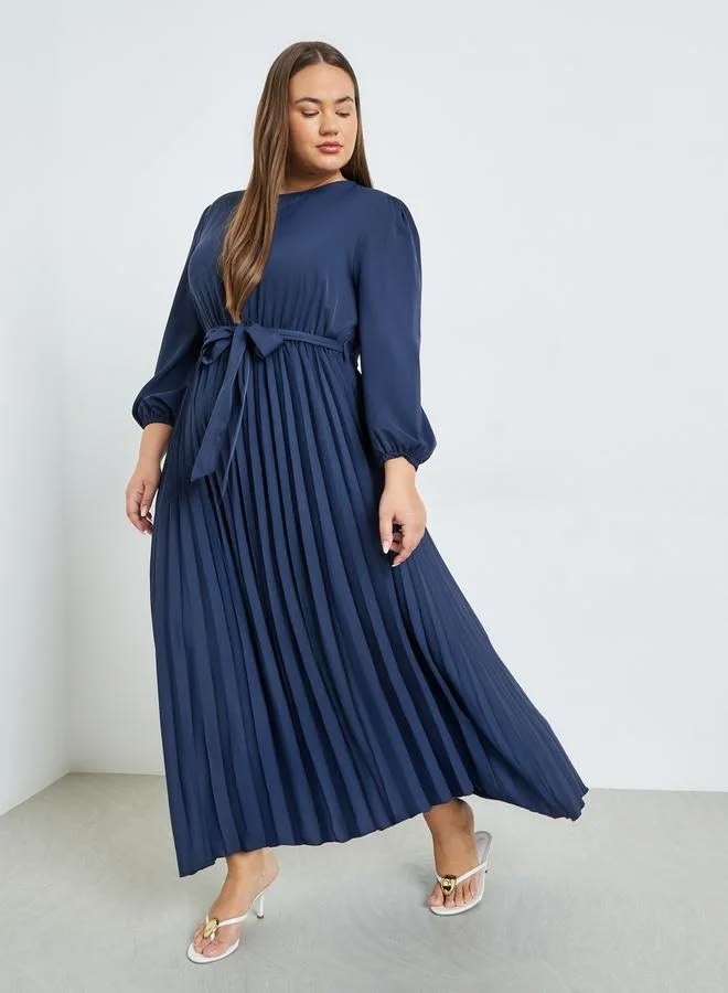 Navy blue pleated maxi dress for a wedding guest