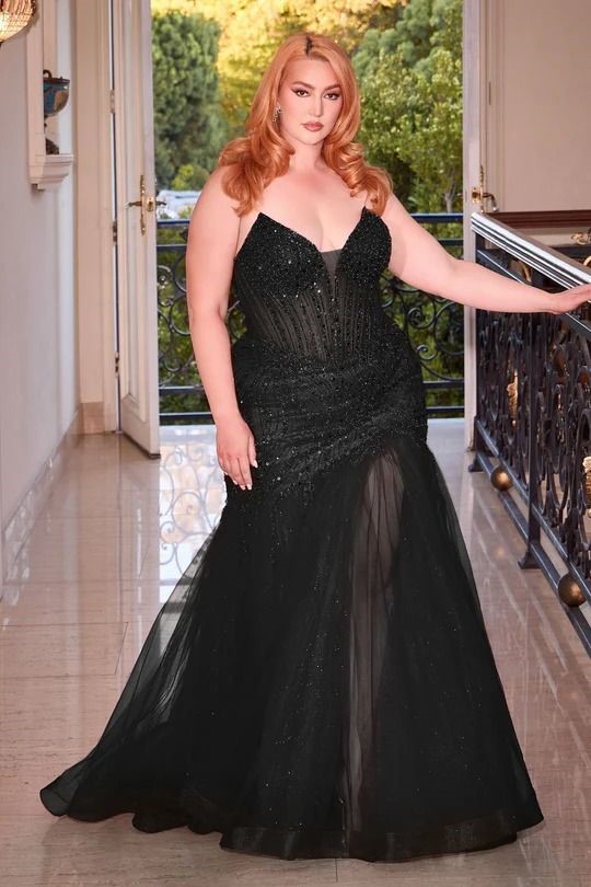 Red carpet looks for curvy women featuring a black full-skirt gown with a structured bodice