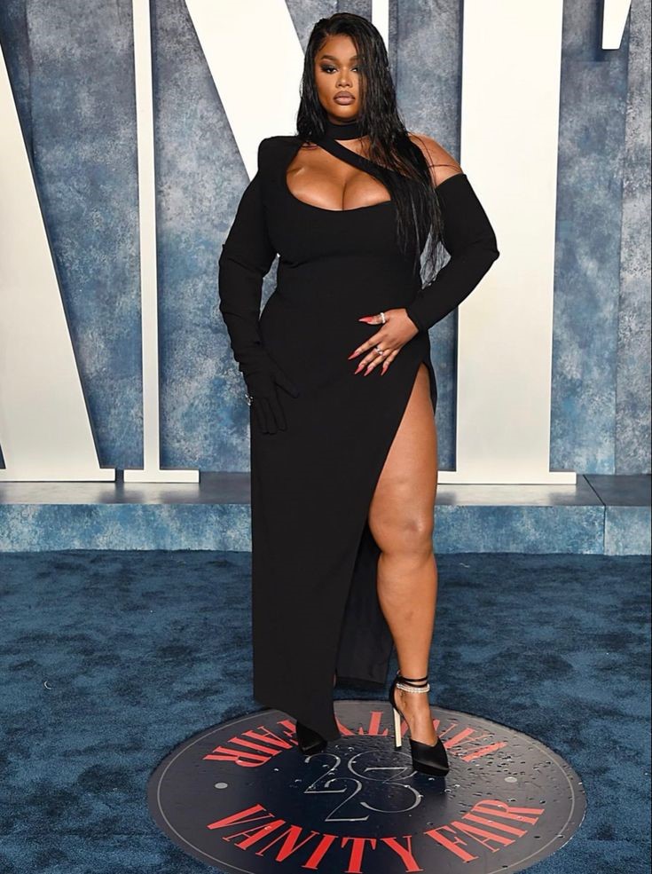 Precious Lee wearing a bold sculptural gown on the red carpet