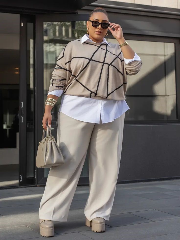 Plus-size woman in a layered sweater and wide-leg trousers showing why you can stop waiting to lose weight before dressing well
