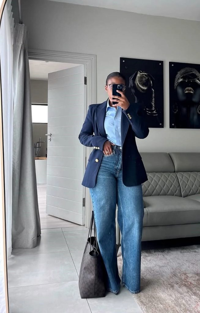 Plus size woman wearing jeans with a blue blazer and button-down shirt